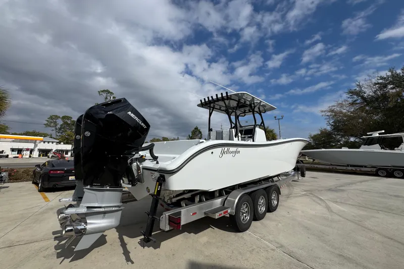 Slide: The Image of 2026 Yellowfin 34 Offshore boat on trailer, featuring powerful Mercury outboard engines. - 14
