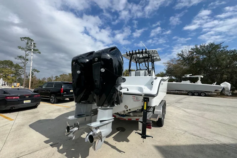 Slide: The Image of 2026 Yellowfin 34 Offshore boat with dual outboard motors on a trailer. - 15