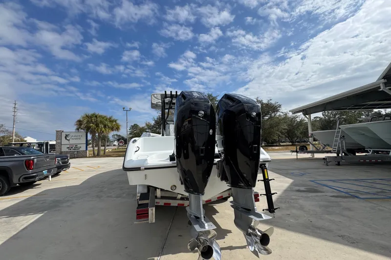 Slide: The Image of 2026 Yellowfin 34 Offshore boat with dual outboard motors in a marina setting. - 17