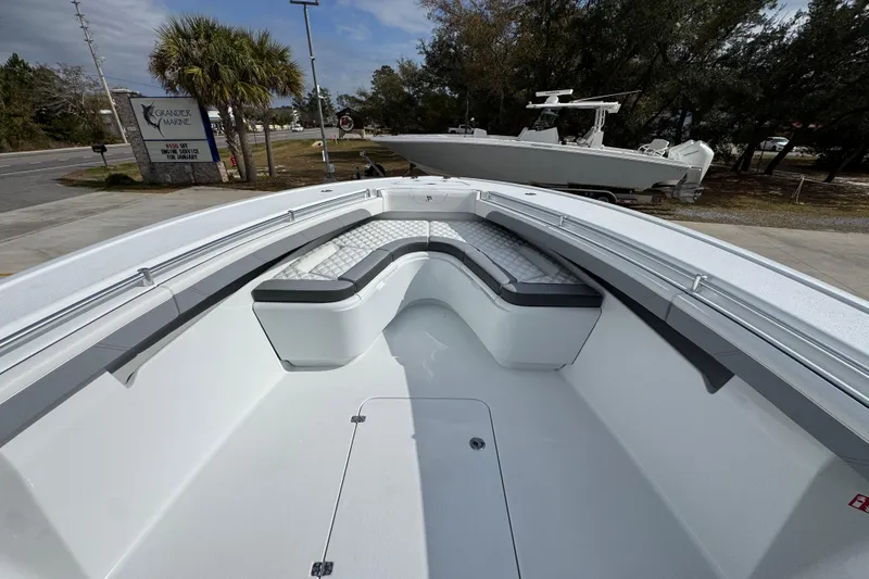 Slide: The Image of 2026 Yellowfin 34 Offshore boat interior with cushioned seating and sleek design. - 21