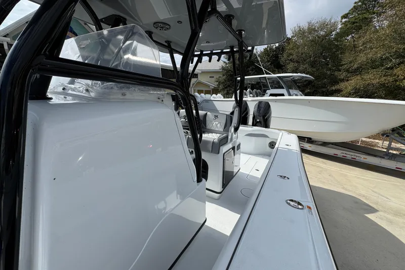 Slide: The Image of 2026 Yellowfin 34 Offshore boat interior with seating and console, parked on a trailer. - 31