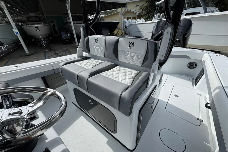 Slide: The Image of 2026 Yellowfin 34 Offshore boat interior with dual seats and steering wheel. - 33