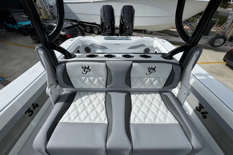 Slide: The Image of 2026 Yellowfin 34 Offshore boat interior with stylish seating and cup holders. - 34