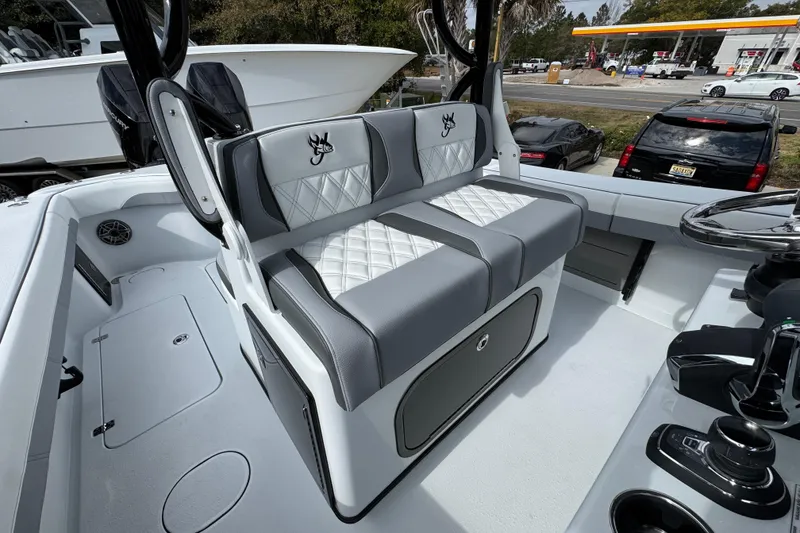 Slide: The Image of 2026 Yellowfin 34 Offshore boat interior with stylish seating and modern controls. - 36
