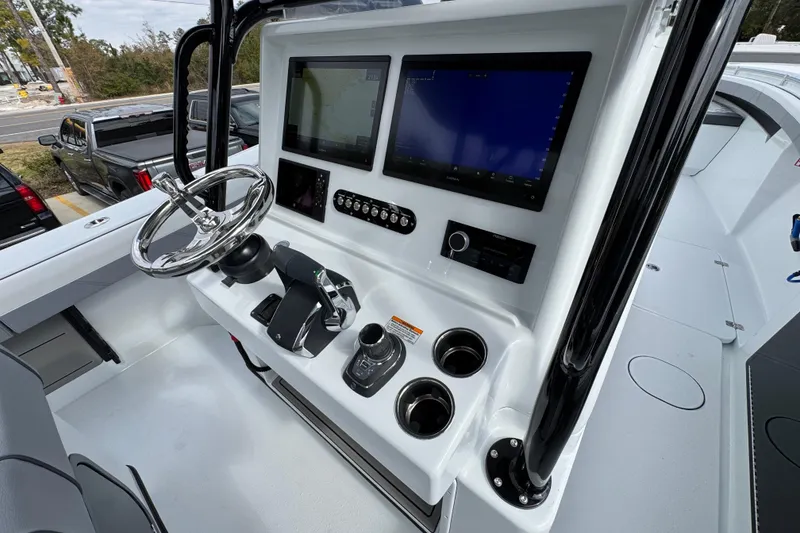 Slide: The Image of 2026 Yellowfin 34 Offshore boat cockpit with advanced navigation displays and controls. - 41