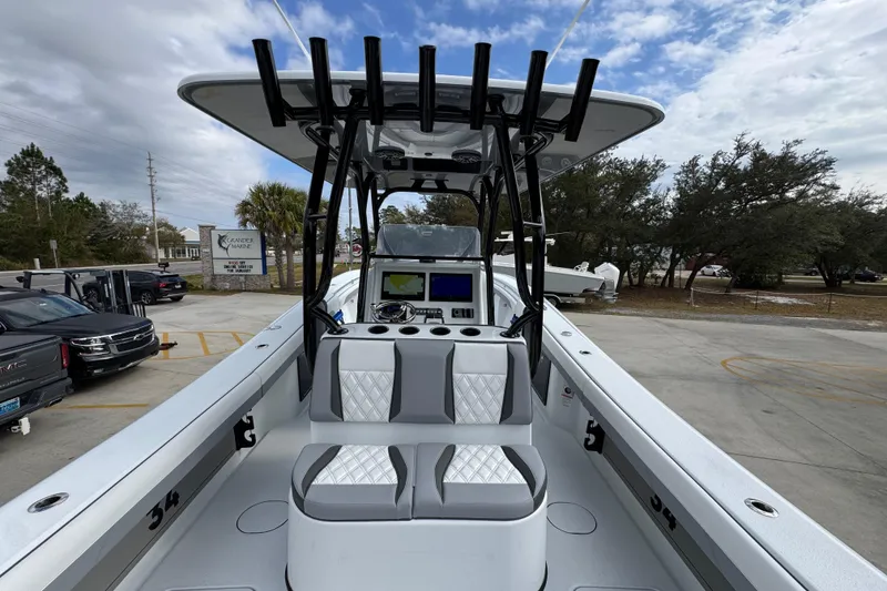 Slide: The Image of 2026 Yellowfin 34 Offshore boat with dual seats and navigation console. - 44