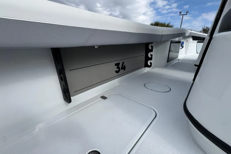 Slide: The Image of 2026 Yellowfin 34 Offshore boat interior with sleek design and storage features. - 46