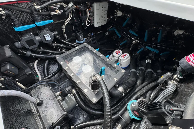 Slide: The Image of Engine compartment of 2026 Yellowfin 34 Offshore boat, showcasing complex wiring and components. - 51