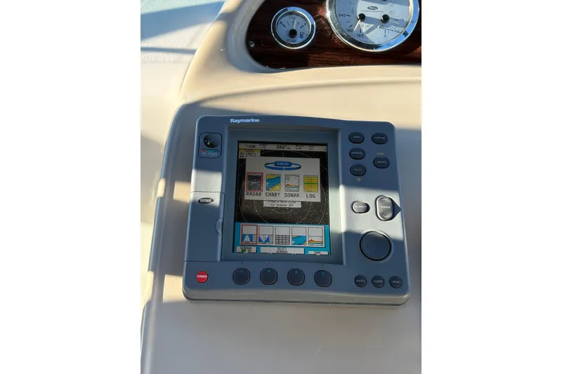 Slide: The Image of 2001 Chaparral Signature 300 boat dashboard with steering wheel and gauges. - 10
