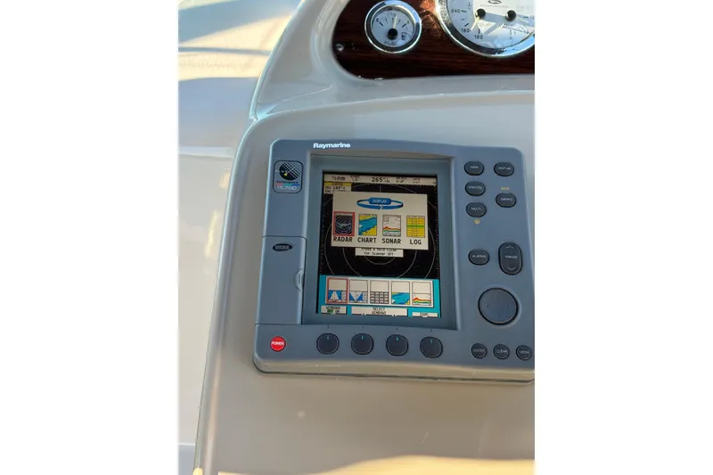 Slide: The Image of 2001 Chaparral Signature 300 dashboard with steering wheel and radio controls. - 12