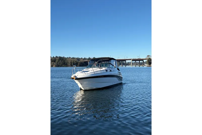 Slide: The Image of 2001 Chaparral Signature 300 boat side view with logo and handle. - 2