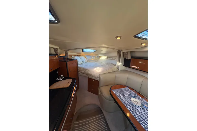 Slide: The Image of Interior of 2001 Chaparral Signature 300 yacht with cozy seating and table. - 20