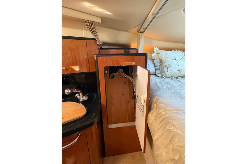 Slide: The Image of 2001 Chaparral Signature 300 interior with wood paneling and stereo system. - 30