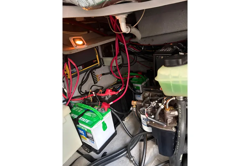 Slide: The Image of Engine compartment of a 2001 Chaparral Signature 300 boat, showcasing mechanical components. - 39