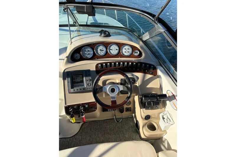 Slide: The Image of 2001 Chaparral Signature 300 boat on calm water near a bridge. - 9