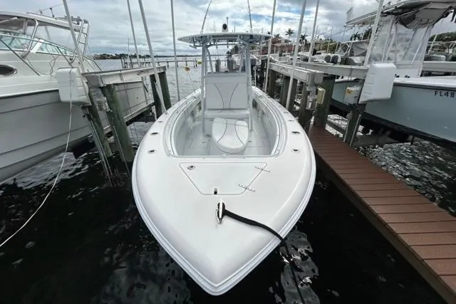 Slide: The Image of 2023 Contender 28 Tournament boat docked at marina, front view. - 4