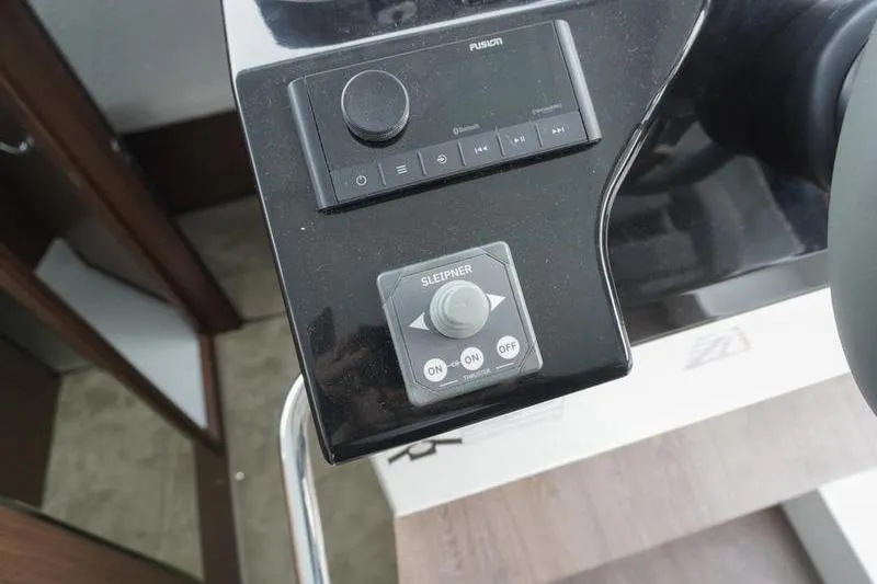 Slide: The Image of Control panel of 2026 Beneteau Antares 11 Fly with navigation display and controls. - 20