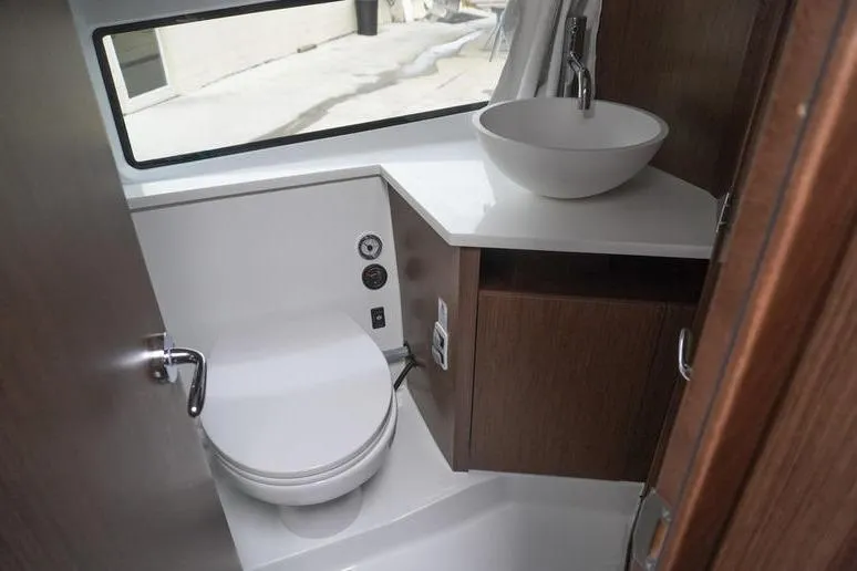 Slide: The Image of Interior of 2026 Beneteau Antares 11 Fly, featuring helm and seating area. - 22