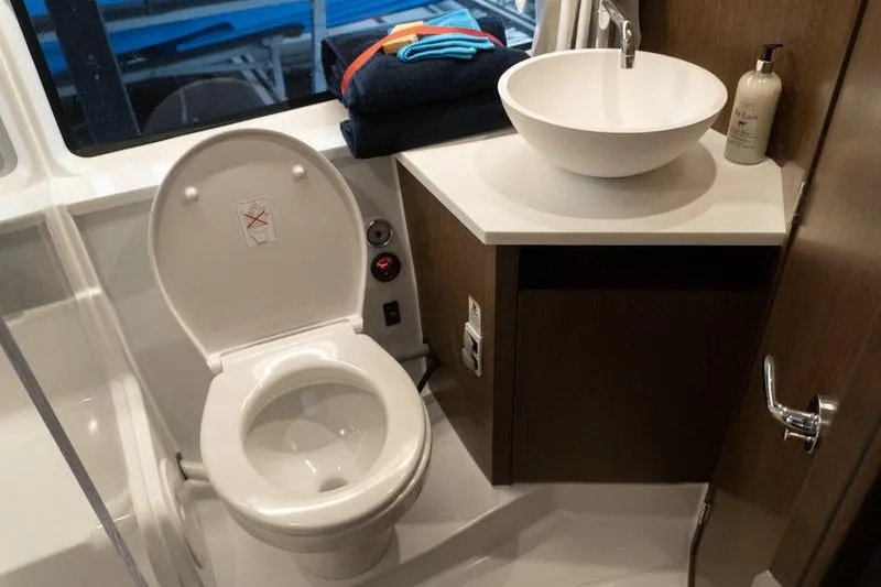 Slide: The Image of Modern bathroom in 2026 Beneteau Antares 11 Fly yacht with toilet and sink. - 28