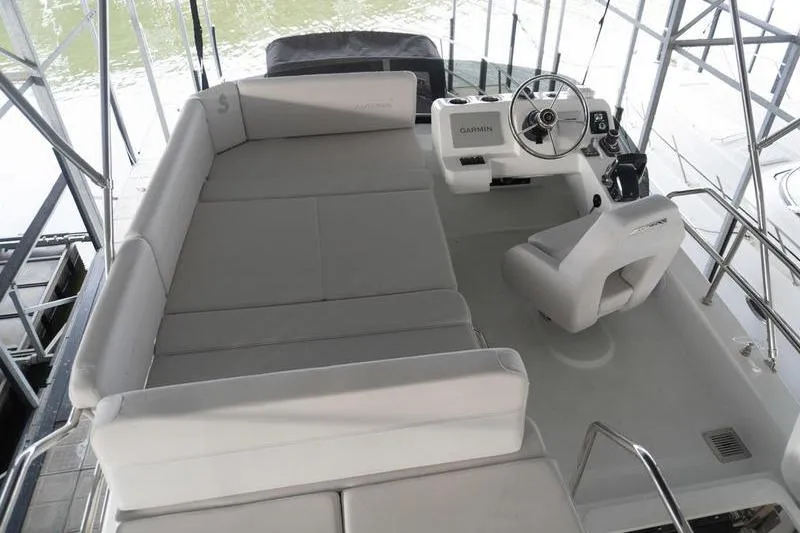 Slide: The Image of 2026 Beneteau Antares 11 Flybridge with spacious seating and modern helm controls. - 41