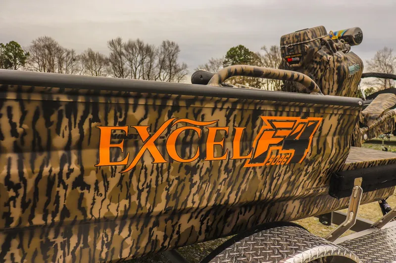 Slide: The Image of 2026 Excel 1751 Shallow Water F4 boat with camouflage design and bold orange logo. - 10