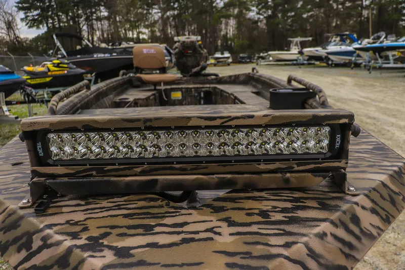 Slide: The Image of 2026 Excel 1751 Shallow Water F4 boat with camo design and LED light bar. - 14