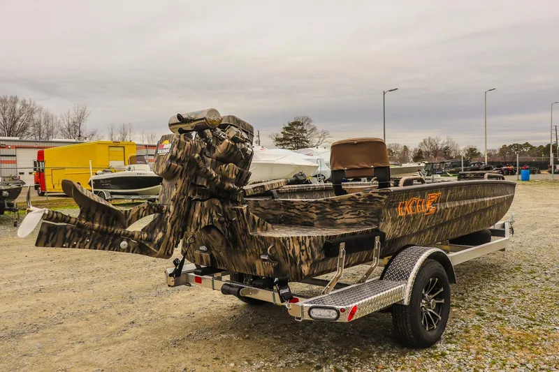 Slide: The Image of 2026 Excel 1751 Shallow Water F4 boat with camouflage design on a trailer. - 4