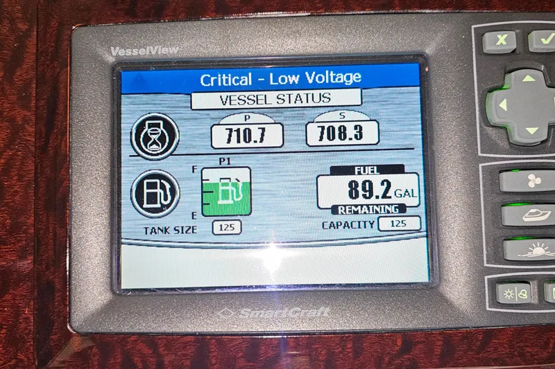 Slide: The Image of Sea Ray Sundancer 310 2010 vessel display showing critical low voltage and fuel status. - 11