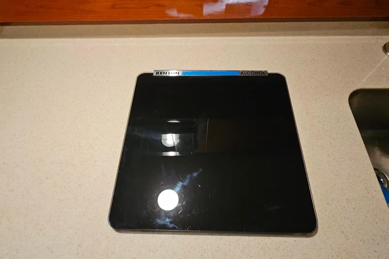 Slide: The Image of Control panel of a 2010 Sea Ray Sundancer 310 boat, showing generator and bilge blower. - 23