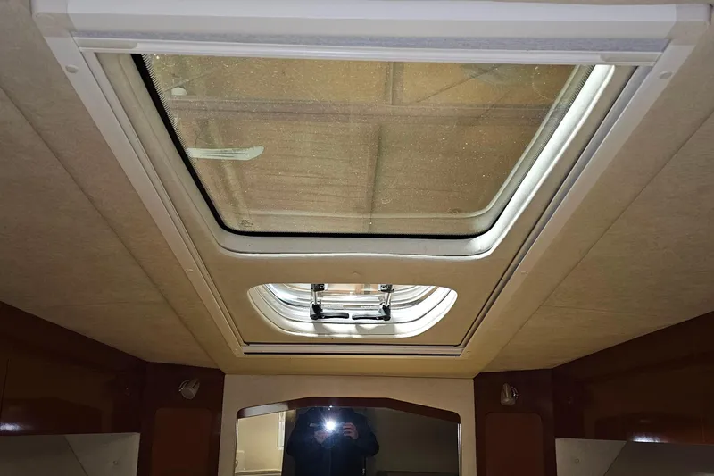 Slide: The Image of Interior view of 2010 Sea Ray Sundancer 310 cabin skylight. - 30