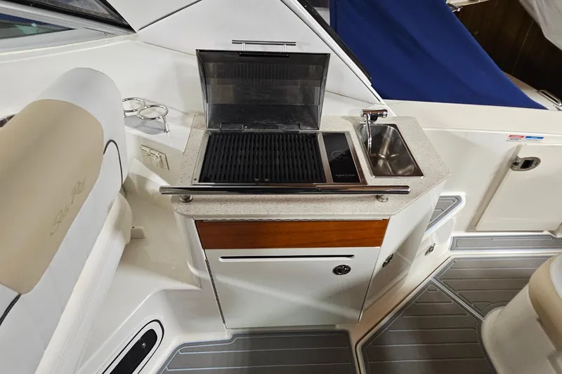 Slide: The Image of Outdoor kitchenette on 2010 Sea Ray Sundancer 310 yacht with grill and sink. - 6