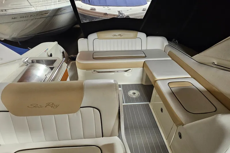 Slide: The Image of Interior of 2010 Sea Ray Sundancer 310 boat with seating and kitchenette. - 7
