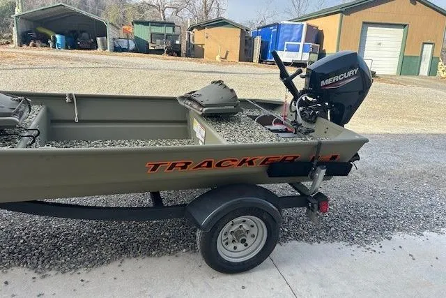 Slide: The Image of 2025 Tracker Grizzly 1436 Utility boat with Mercury motor on a trailer. - 57