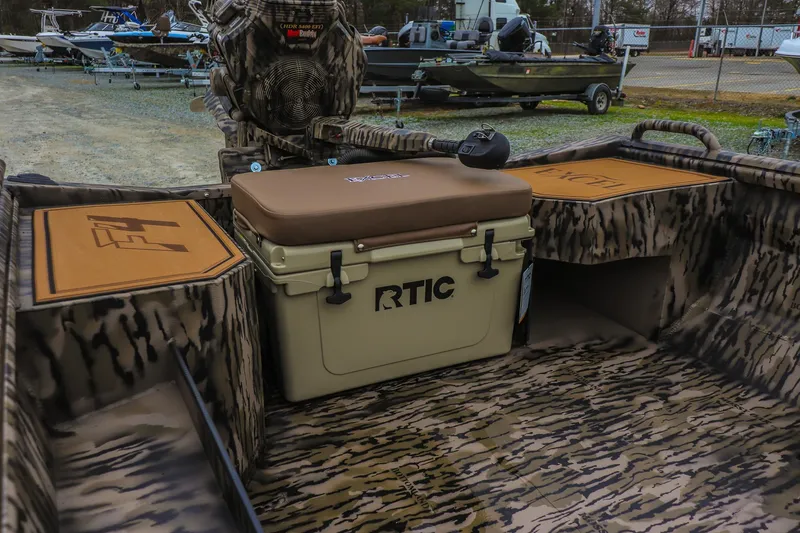 Slide: The Image of Camouflage interior of 2026 Excel 1751 F4 Pro boat with RTIC cooler. - 13