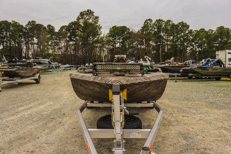 Slide: The Image of 2026 Excel 1751 F4 Pro boat on trailer in outdoor lot. - 7