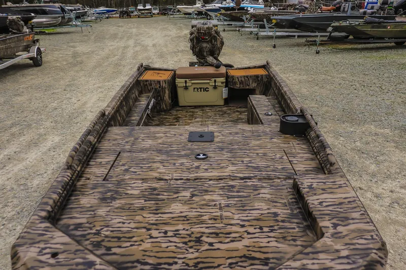 Slide: The Image of Camouflage-patterned Excel 1751 F4 Pro boat, 2026 model, with RTIC cooler on deck. - 8