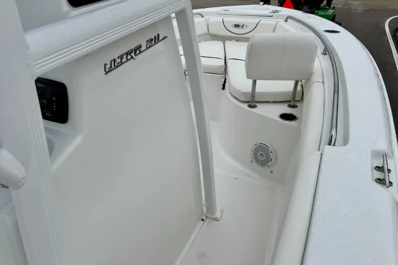 Slide: The Image of 2016 Sea Hunt Ultra 211 boat interior with seating and console details. - 15