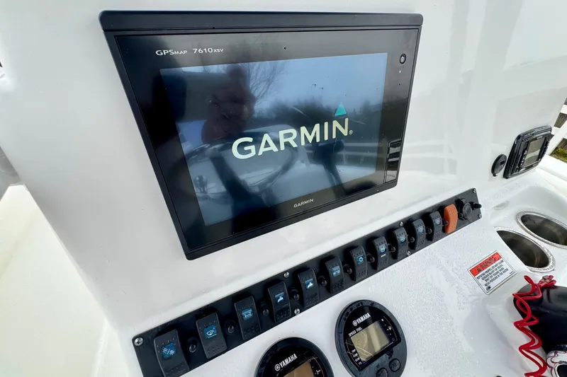 Slide: The Image of Garmin GPS display on 2016 Sea Hunt Ultra 211 boat dashboard with control panel. - 17