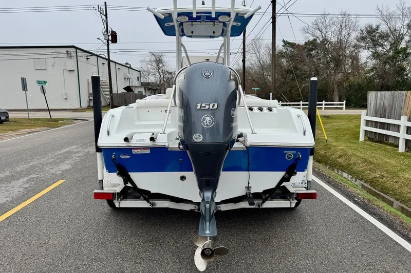 Slide: The Image of 2016 Sea Hunt Ultra 211 boat with Yamaha 150 engine on a road. - 3