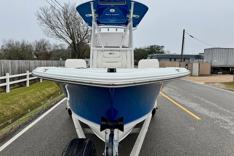 Slide: The Image of 2016 Sea Hunt Ultra 211 boat on trailer, parked on a road. - 6