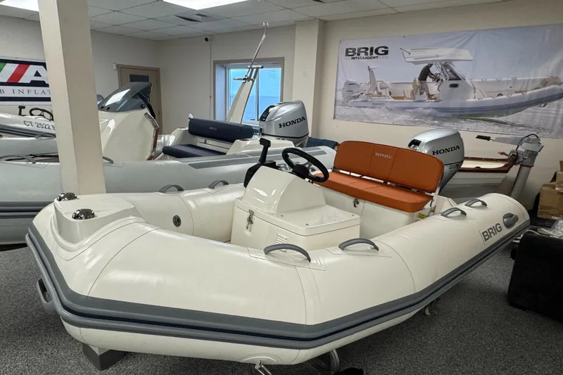 The Image of 2026 Brig Falcon 330 inflatable boat with Honda outboard motor in showroom. - 0