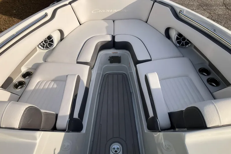 Slide: The Image of 2026 Crownline 220 SS boat interior with white seating and cup holders. - 7