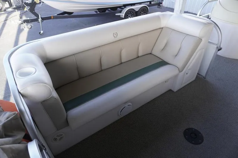 Slide: The Image of Luxurious seating on 2000 Sundancer Pontoons 240 Majestic boat, featuring plush upholstery. - 13