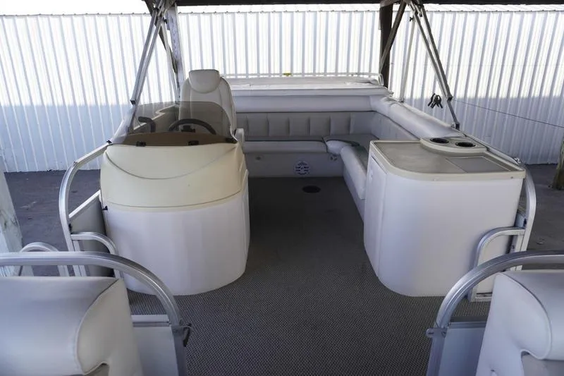 Slide: The Image of Interior of 2000 Sundancer Pontoons 240 Majestic boat with seating and helm. - 16