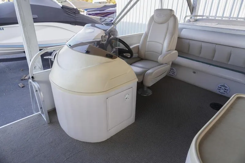 Slide: The Image of Interior of a 2000 Sundancer Pontoons 240 Majestic boat with helm and seating. - 17