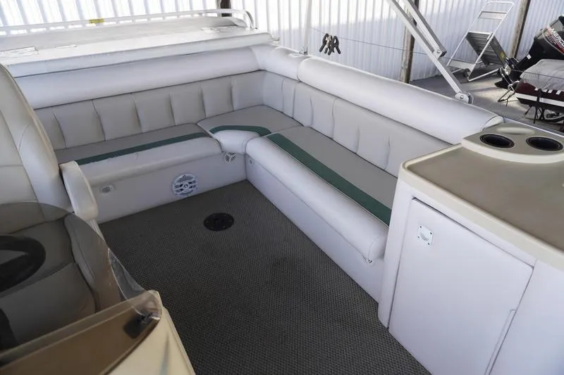 Slide: The Image of 2000 Sundancer Pontoons 240 Majestic interior with plush seating and cup holders. - 24