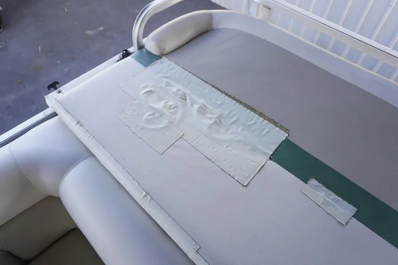 Slide: The Image of Damaged seat on 2000 Sundancer Pontoons 240 Majestic, repaired with tape. - 29