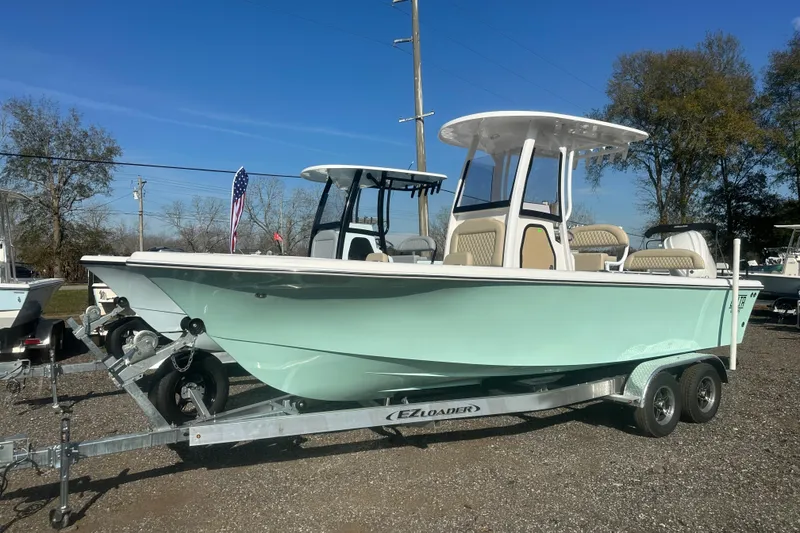 The Image of 2026 Delta Boatworks Delta D245 on trailer, light blue hull, sunny day. - 0