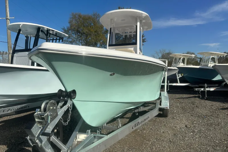 Slide: The Image of 2026 Delta Boatworks Delta D245 on trailer, displayed outdoors under clear blue sky. - 5