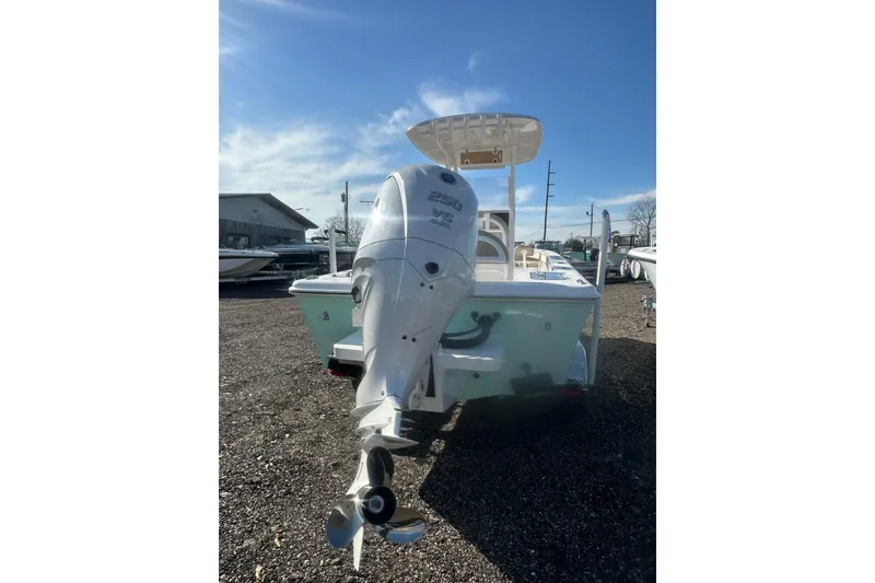 Slide: The Image of 2026 Delta Boatworks Delta D245 with powerful outboard motor, parked outdoors. - 6